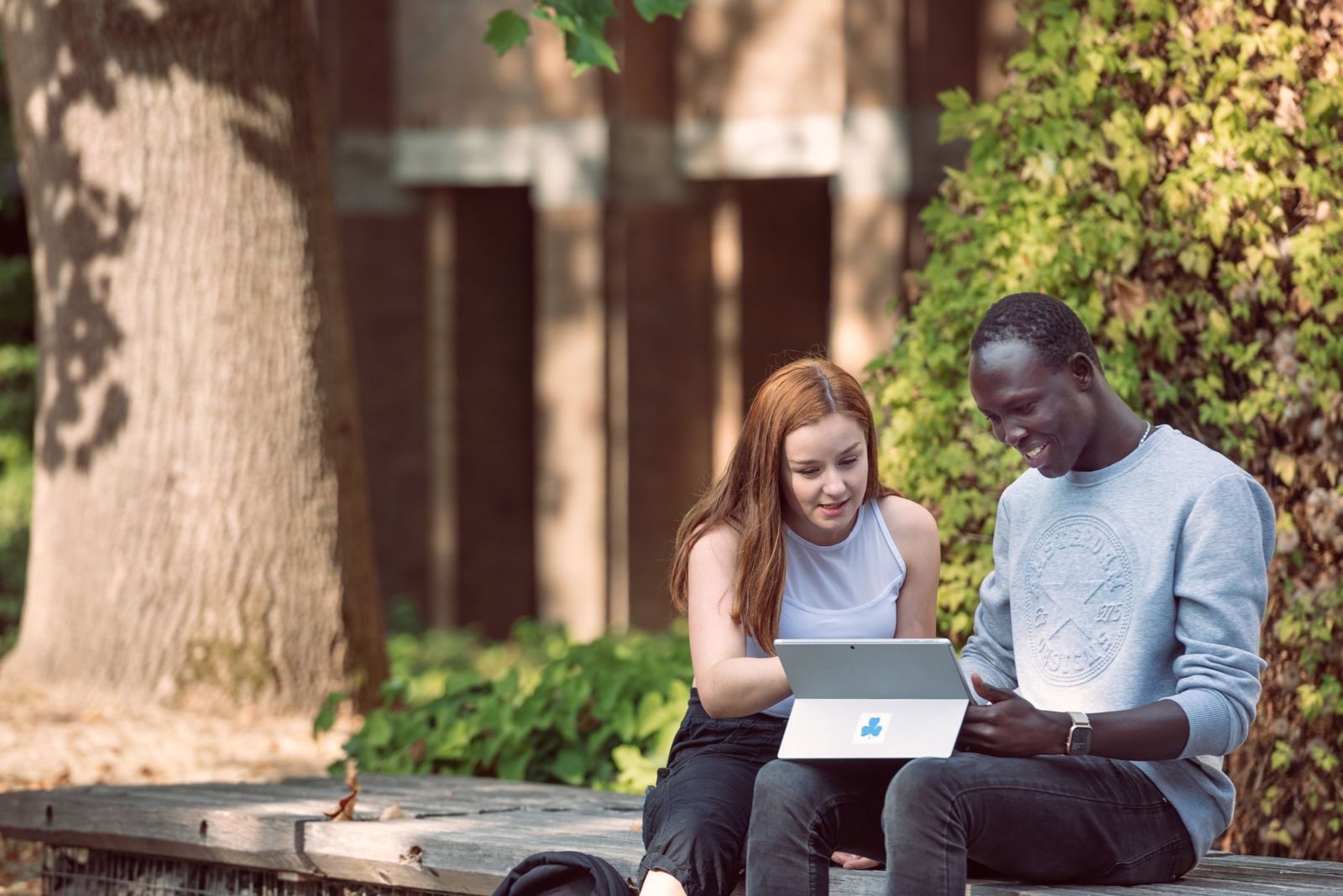 Students looking at a tablet